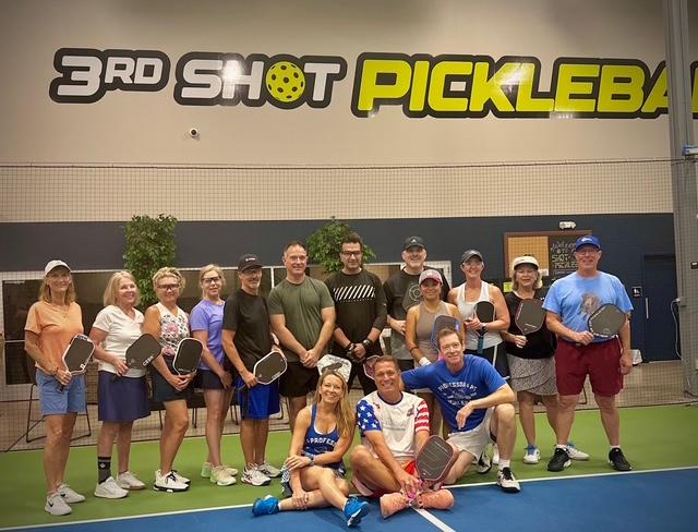 outdoor pickleball courts at sports complex, sunny day, well maintained facility