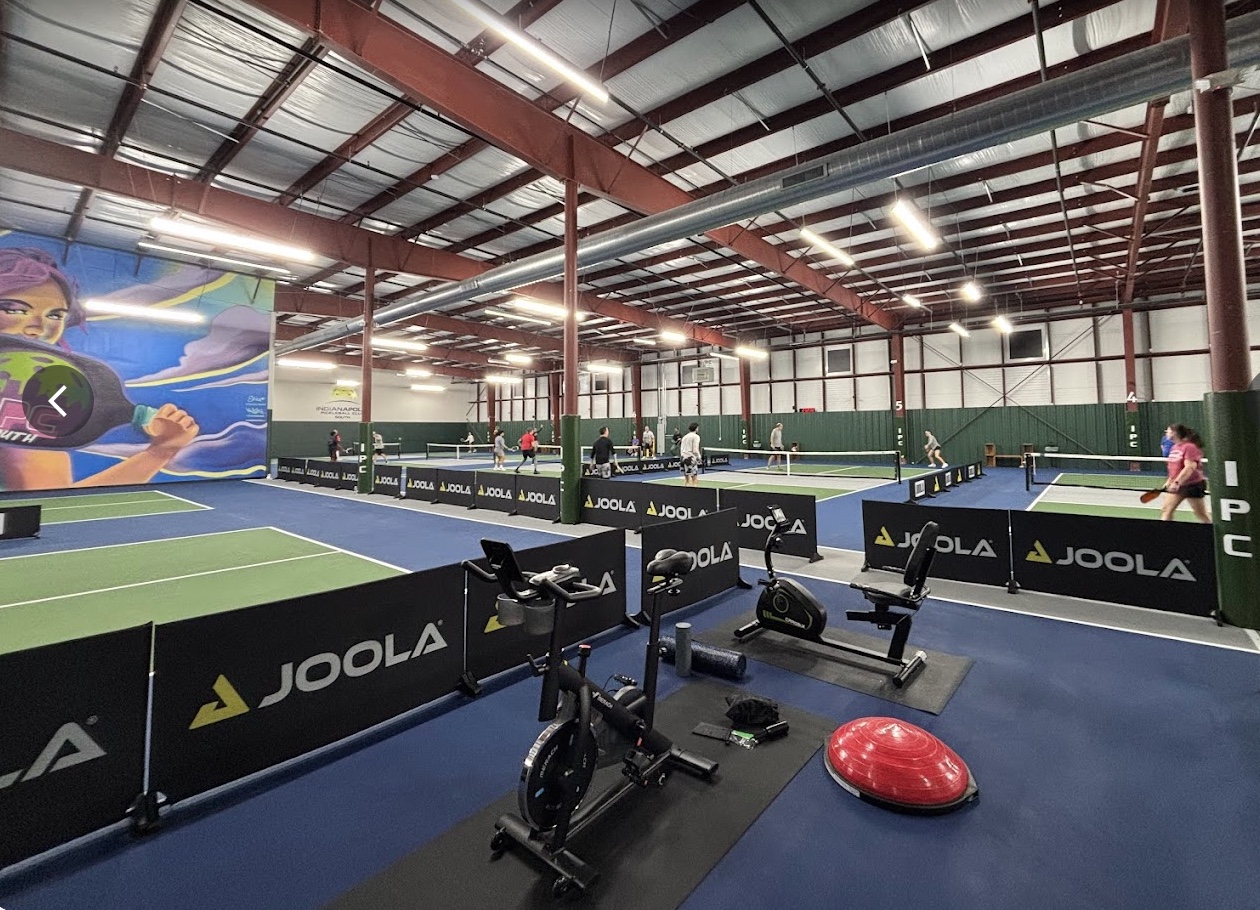 premium indoor pickleball facility with spectator seating, tournament ready courts