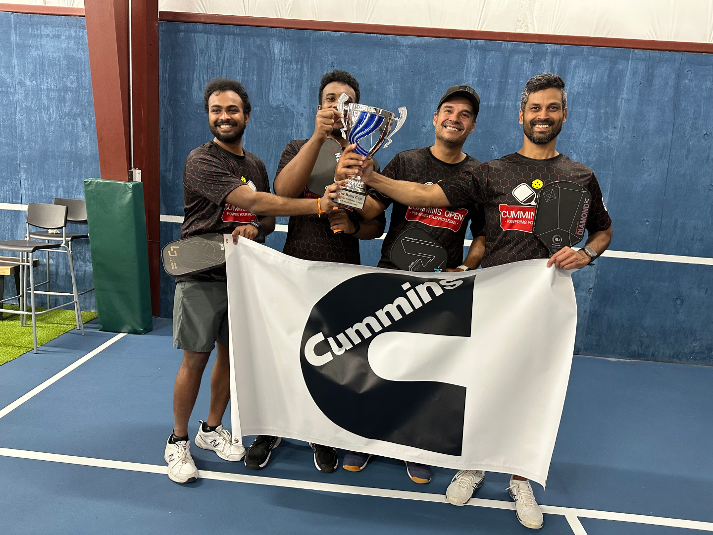 diverse group of pickleball players celebrating together at tournament, team spirit, inclusive community, professional sports photography
